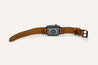 A Zilker Apple Watch Band with a brown leather strap.