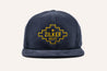 A Corduroy Hat with a Zilker Belts logo on it.